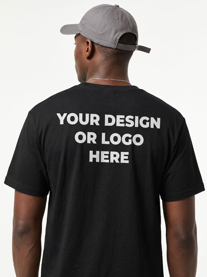Custom back print demo — model in a black tee reading Your Design Or Logo Here